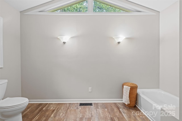 15 Beaverdam Ct, Asheville, NC 28804 - full bathroom with wood finished floors, a bathtub, and vaulted ceiling