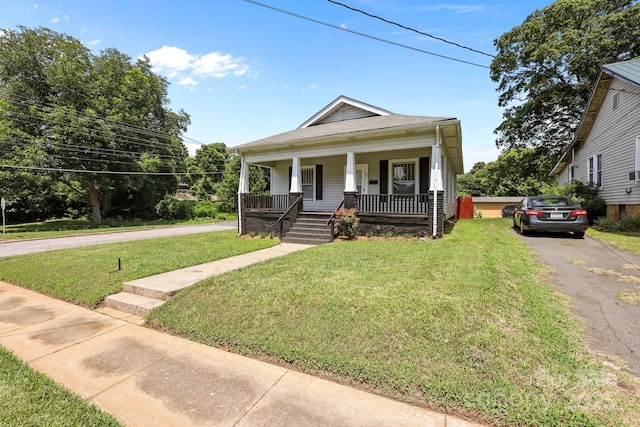 200 N Martin Luther King Jr Ave, Salisbury, NC 28144 - view of front of home featuring a porch, a front lawn, and driveway