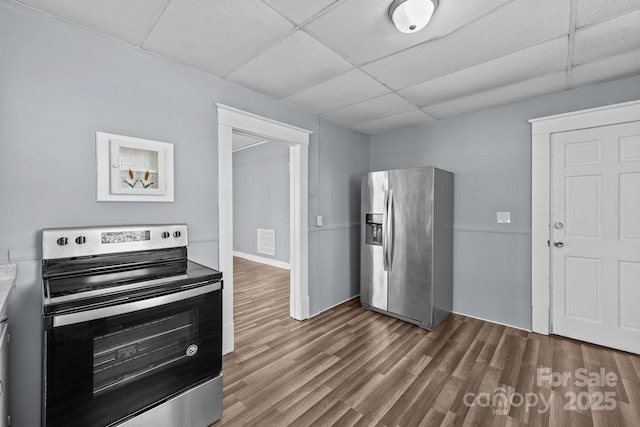 200 N Martin Luther King Jr Ave, Salisbury, NC 28144 - kitchen with appliances with stainless steel finishes, a paneled ceiling, and wood finished floors