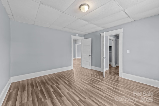 200 N Martin Luther King Jr Ave, Salisbury, NC 28144 - unfurnished bedroom featuring a drop ceiling and wood finished floors