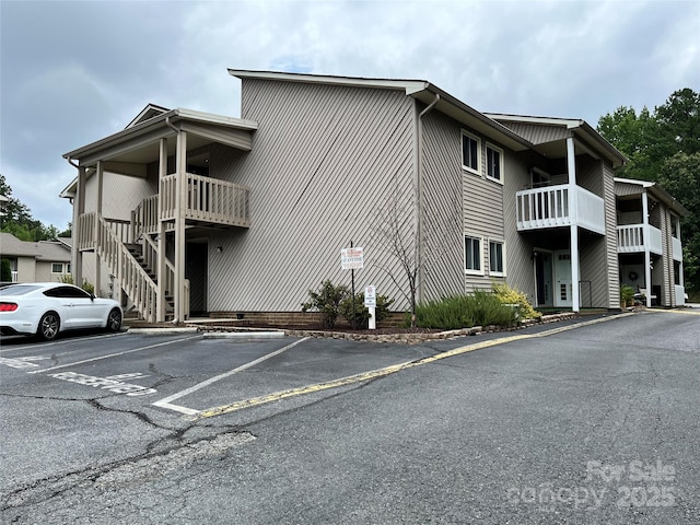 140 Lake Concord Rd NE Unit B7, Concord, NC 28025 - view of property featuring uncovered parking and stairs