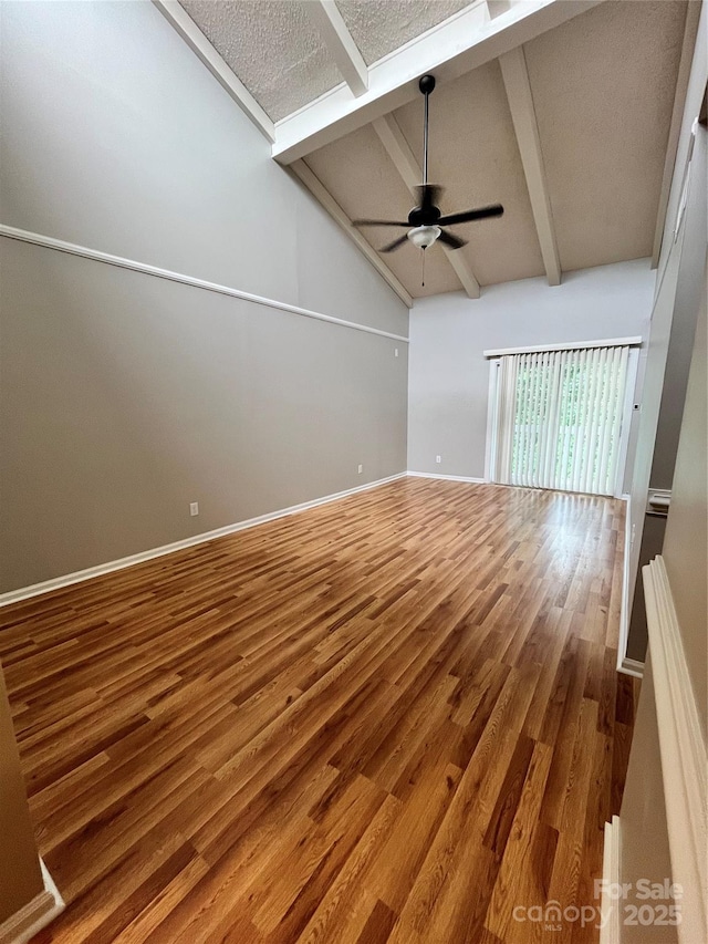 140 Lake Concord Rd NE Unit B7, Concord, NC 28025 - unfurnished room with wood finished floors, beam ceiling, ceiling fan, and high vaulted ceiling