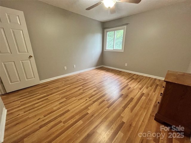 140 Lake Concord Rd NE Unit B7, Concord, NC 28025 - empty room featuring light wood-style floors and a ceiling fan