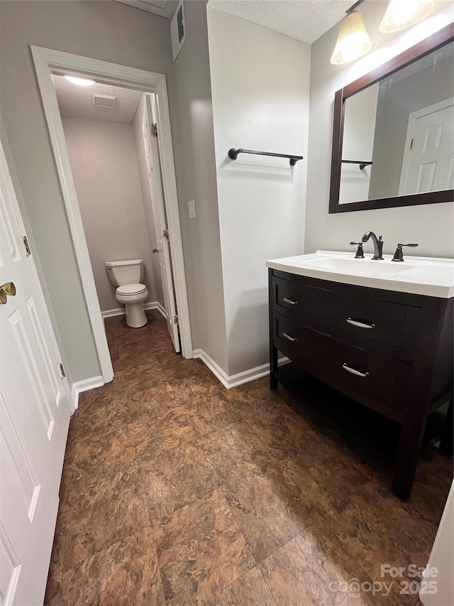 140 Lake Concord Rd NE Unit B7, Concord, NC 28025 - bathroom featuring vanity and a textured ceiling