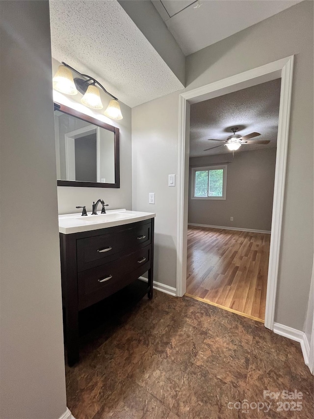 140 Lake Concord Rd NE Unit B7, Concord, NC 28025 - bathroom with a textured ceiling, vanity, and a ceiling fan