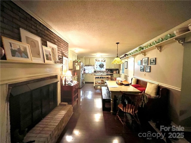 5419 Stevens Mill Rd, Matthews, NC 28104 - dining space featuring a textured ceiling and a fireplace