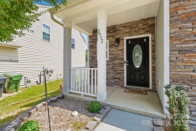 2932 Berry Creek Rd, Charlotte, NC 28214 - view of exterior entry with stone siding and covered porch