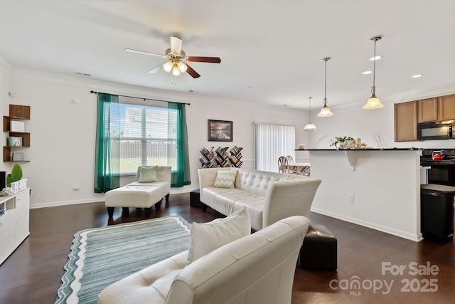 2932 Berry Creek Rd, Charlotte, NC 28214 - living room with a ceiling fan, dark wood-type flooring, recessed lighting, and crown molding