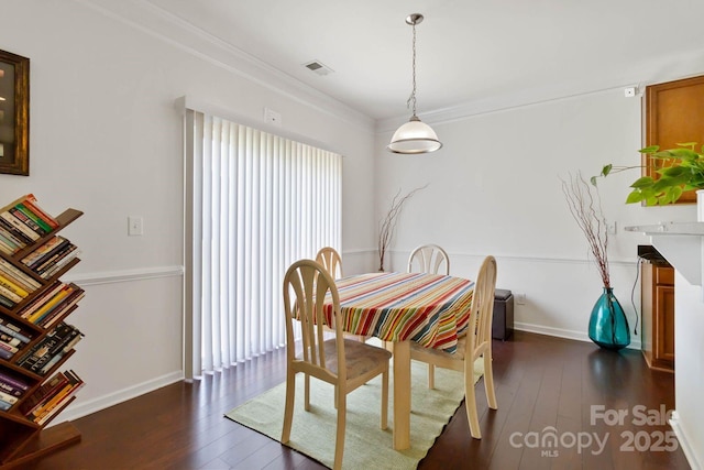 2932 Berry Creek Rd, Charlotte, NC 28214 - dining room featuring dark wood-style floors and crown molding