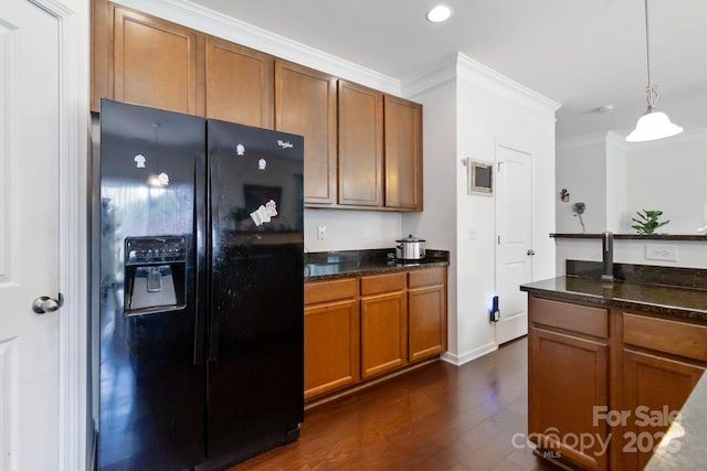 2932 Berry Creek Rd, Charlotte, NC 28214 - kitchen featuring black fridge with ice dispenser, crown molding, dark wood-style flooring, brown cabinetry, and pendant lighting