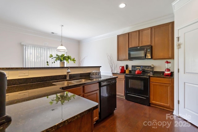 2932 Berry Creek Rd, Charlotte, NC 28214 - kitchen featuring black appliances, brown cabinetry, ornamental molding, dark wood-style flooring, and recessed lighting
