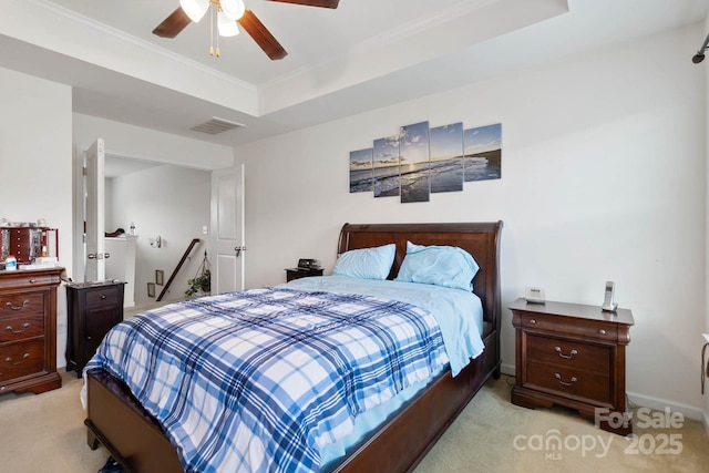 2932 Berry Creek Rd, Charlotte, NC 28214 - bedroom featuring light colored carpet, a raised ceiling, ornamental molding, and a ceiling fan