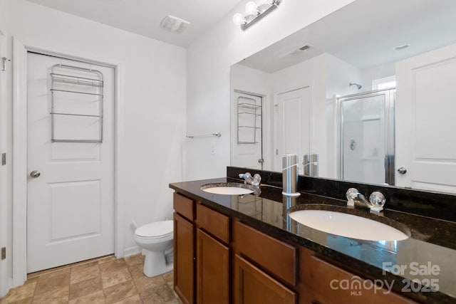 2932 Berry Creek Rd, Charlotte, NC 28214 - full bath with a stall shower, double vanity, and stone finish floors