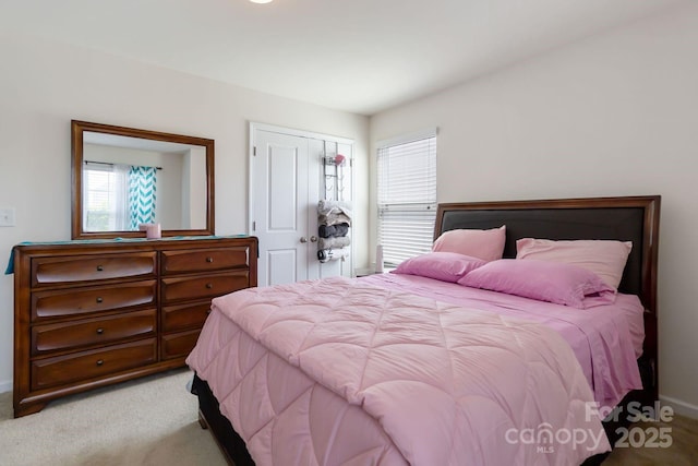 2932 Berry Creek Rd, Charlotte, NC 28214 - bedroom with multiple windows, carpet floors, and a closet