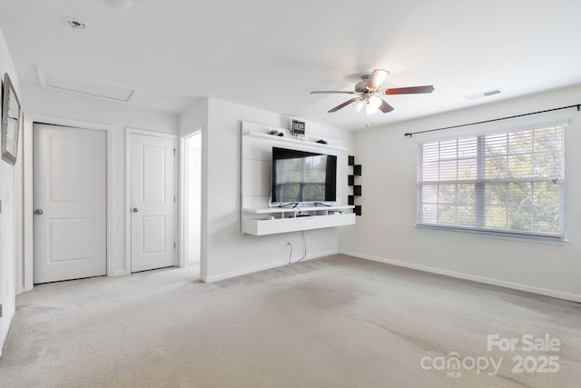 2932 Berry Creek Rd, Charlotte, NC 28214 - unfurnished living room featuring a ceiling fan, light carpet, and attic access