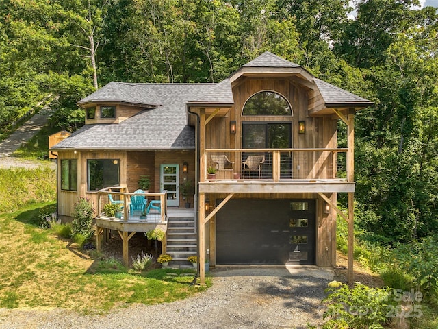 184 Sandys Home Pl, Mars Hill, NC 28754 - rustic home featuring driveway, an attached garage, a shingled roof, a porch, and stairway