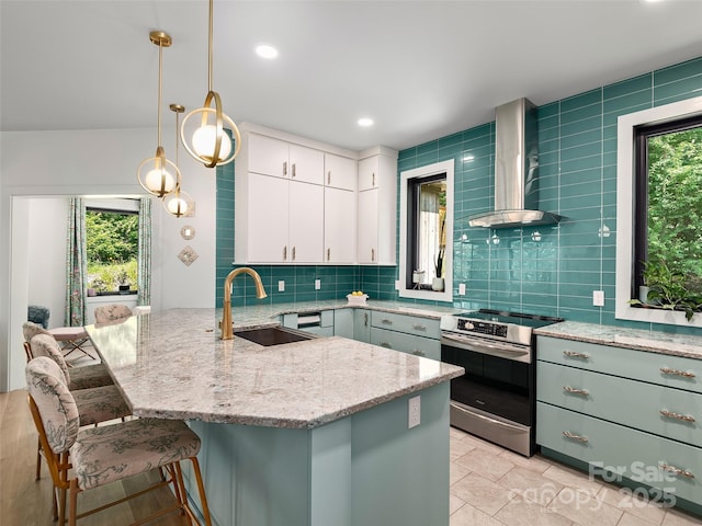 184 Sandys Home Pl, Mars Hill, NC 28754 - kitchen featuring stainless steel electric stove, wall chimney range hood, healthy amount of natural light, a peninsula, and recessed lighting
