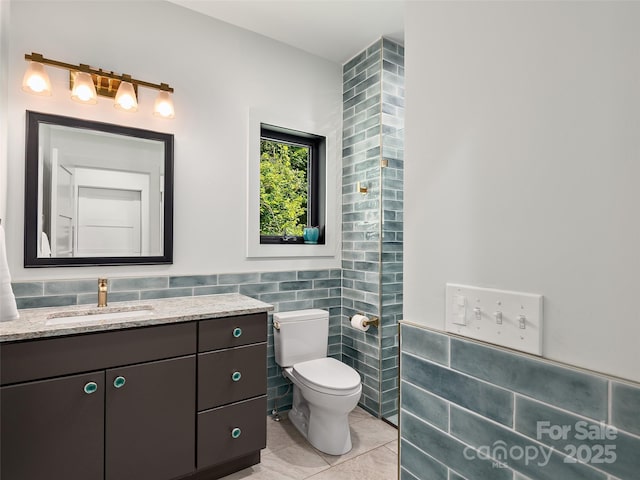 184 Sandys Home Pl, Mars Hill, NC 28754 - bathroom with tile walls, tile patterned flooring, vanity, and wainscoting