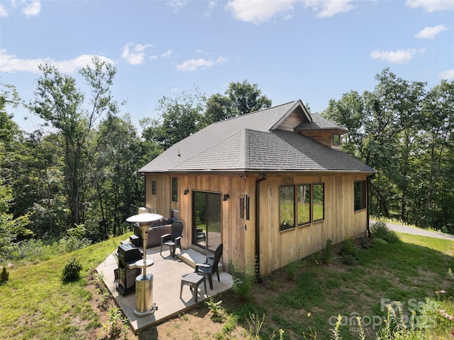 184 Sandys Home Pl, Mars Hill, NC 28754 - view of property exterior with a patio area, roof with shingles, and board and batten siding