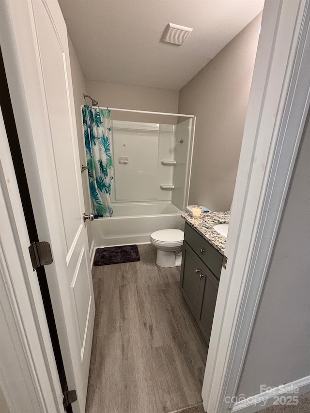 408 E 22nd St, Kannapolis, NC 28083 - full bath featuring wood finished floors, vanity, and shower / tub combo with curtain