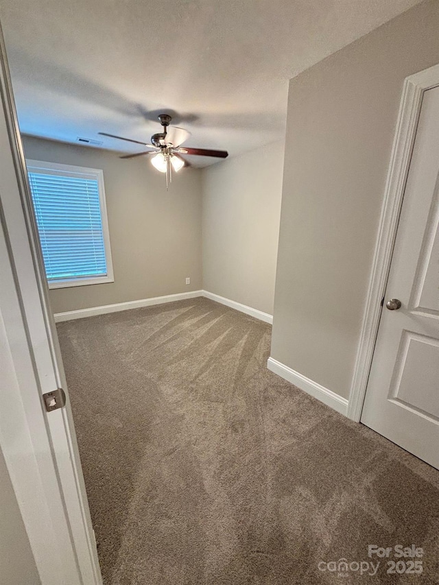 408 E 22nd St, Kannapolis, NC 28083 - unfurnished room with carpet floors and a ceiling fan