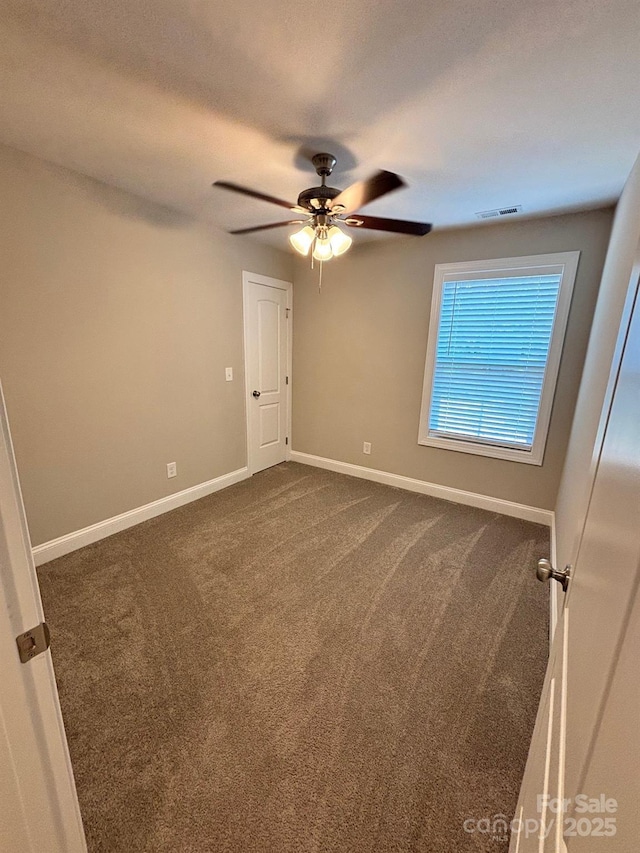 408 E 22nd St, Kannapolis, NC 28083 - unfurnished room featuring dark colored carpet and ceiling fan