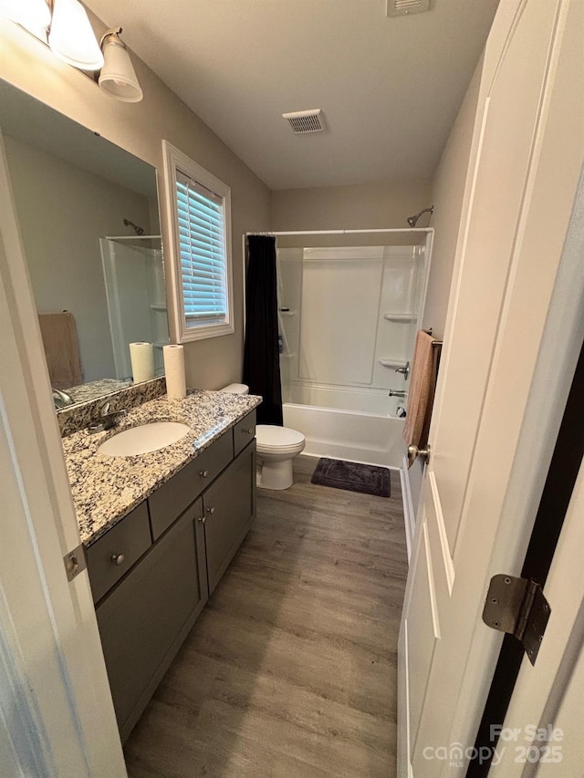 408 E 22nd St, Kannapolis, NC 28083 - full bath with vanity, shower / tub combo with curtain, and wood finished floors