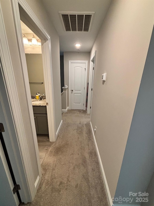 408 E 22nd St, Kannapolis, NC 28083 - corridor featuring light carpet and baseboards