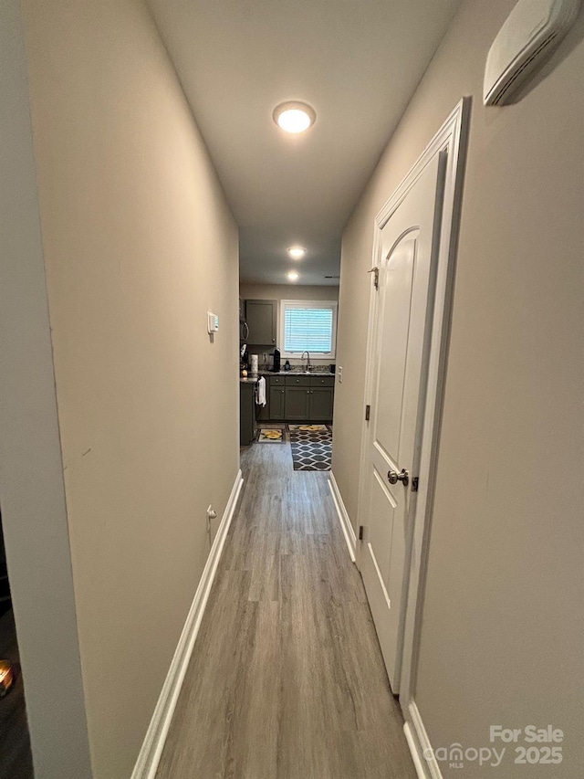 408 E 22nd St, Kannapolis, NC 28083 - hallway with a wall mounted AC and dark wood-type flooring