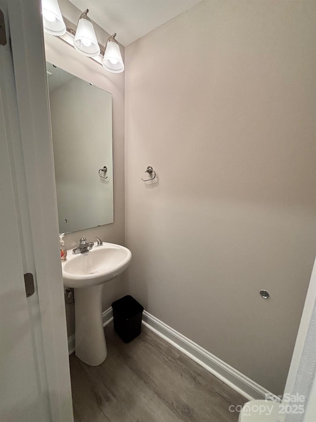 408 E 22nd St, Kannapolis, NC 28083 - bathroom featuring baseboards and wood finished floors