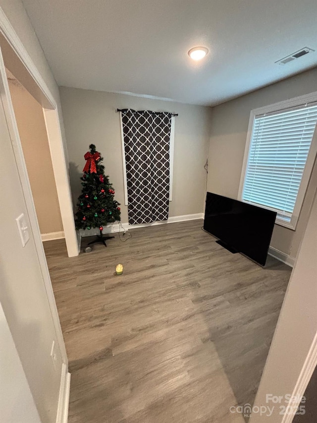 408 E 22nd St, Kannapolis, NC 28083 - unfurnished bedroom with wood finished floors and baseboards