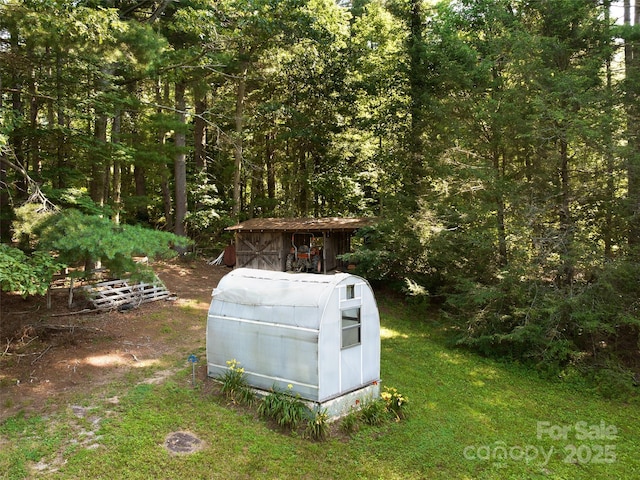 599 Red Fox Ln, Flat Rock, NC 28731 - view of outbuilding with a wooded view