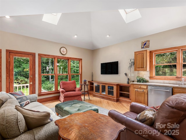 599 Red Fox Ln, Flat Rock, NC 28731 - living room with a skylight, lofted ceiling, light wood-type flooring, and plenty of natural light