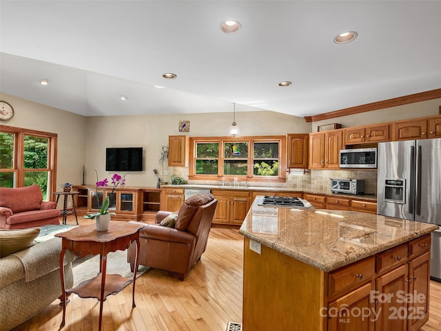 599 Red Fox Ln, Flat Rock, NC 28731 - kitchen with stainless steel appliances, open floor plan, backsplash, light wood finished floors, and recessed lighting