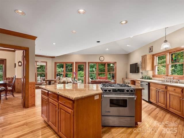 599 Red Fox Ln, Flat Rock, NC 28731 - kitchen with stainless steel appliances, a center island, a wainscoted wall, light wood-type flooring, and pendant lighting