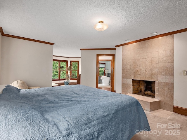 599 Red Fox Ln, Flat Rock, NC 28731 - carpeted bedroom with crown molding, a textured ceiling, a tile fireplace, and recessed lighting