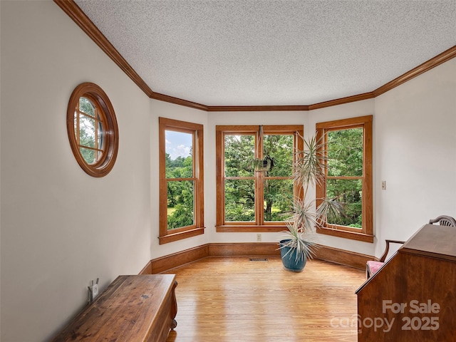 599 Red Fox Ln, Flat Rock, NC 28731 - interior space with wood finished floors, a textured ceiling, and crown molding