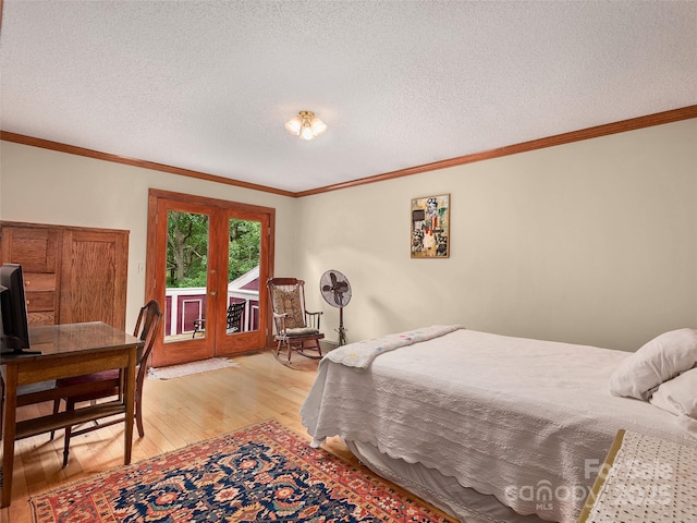 599 Red Fox Ln, Flat Rock, NC 28731 - bedroom with access to exterior, light wood-type flooring, crown molding, and a textured ceiling