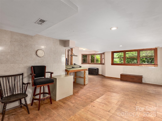 599 Red Fox Ln, Flat Rock, NC 28731 - living room with tile walls, light wood finished floors, and recessed lighting