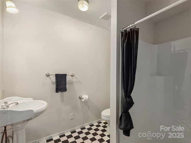599 Red Fox Ln, Flat Rock, NC 28731 - full bath with tile patterned floors and a shower with shower curtain