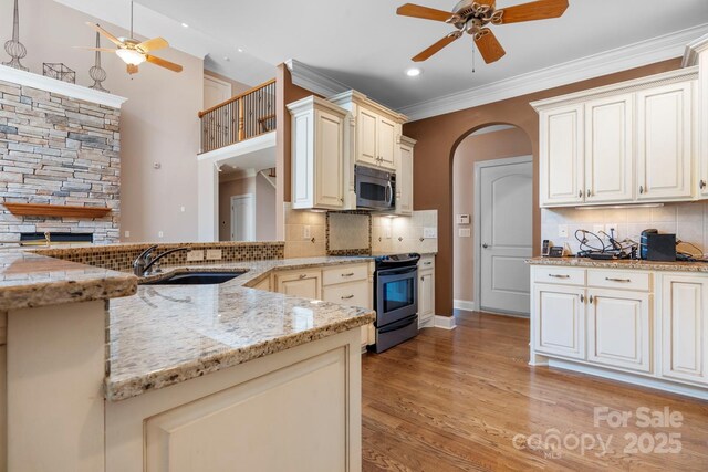 2301 Willow Creek Dr, Newton, NC 28658 - kitchen with ceiling fan, appliances with stainless steel finishes, light stone countertops, backsplash, and recessed lighting