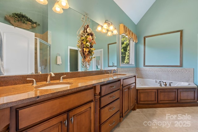2301 Willow Creek Dr, Newton, NC 28658 - bathroom with lofted ceiling, tile patterned floors, a stall shower, double vanity, and a bath