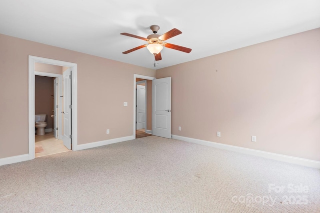 2301 Willow Creek Dr, Newton, NC 28658 - unfurnished bedroom with light colored carpet, ensuite bathroom, and a ceiling fan