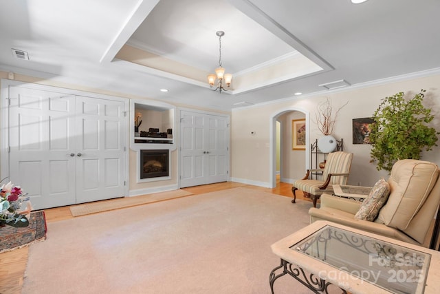 2301 Willow Creek Dr, Newton, NC 28658 - sitting room with ornamental molding, arched walkways, a raised ceiling, wood finished floors, and recessed lighting