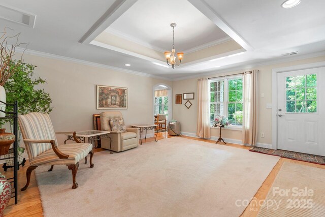 2301 Willow Creek Dr, Newton, NC 28658 - sitting room featuring arched walkways, ornamental molding, a tray ceiling, recessed lighting, and wood finished floors