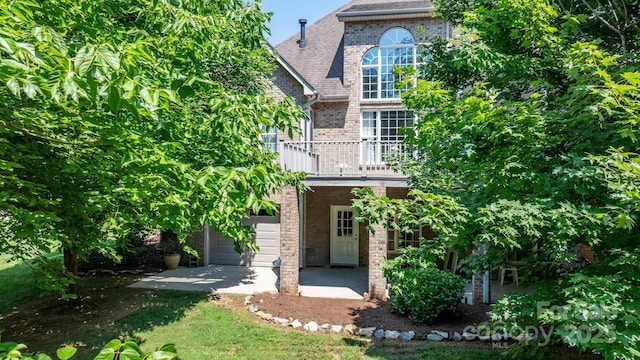 2301 Willow Creek Dr, Newton, NC 28658 - view of front facade featuring brick siding, a balcony, and roof with shingles