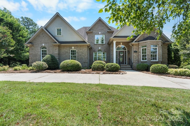2301 Willow Creek Dr, Newton, NC 28658 - view of front facade with a front yard and brick siding