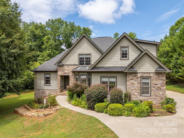 60 Bridge Ln, Tryon, NC 28782 - craftsman house with stone siding, a front yard, and a shingled roof