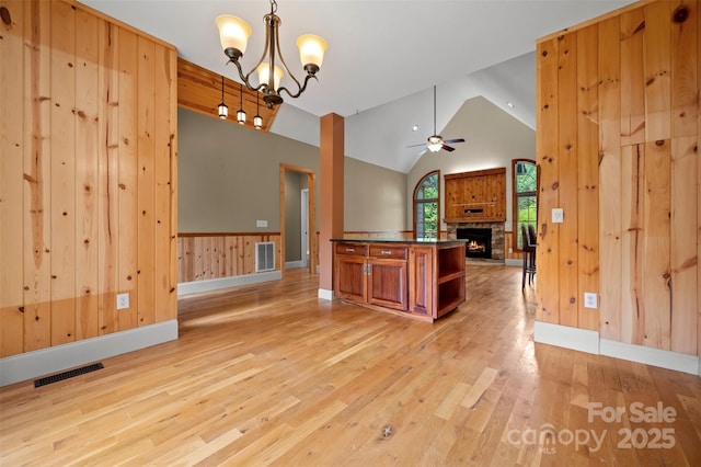 60 Bridge Ln, Tryon, NC 28782 - kitchen featuring open floor plan, light wood-type flooring, dark countertops, brown cabinets, and ceiling fan