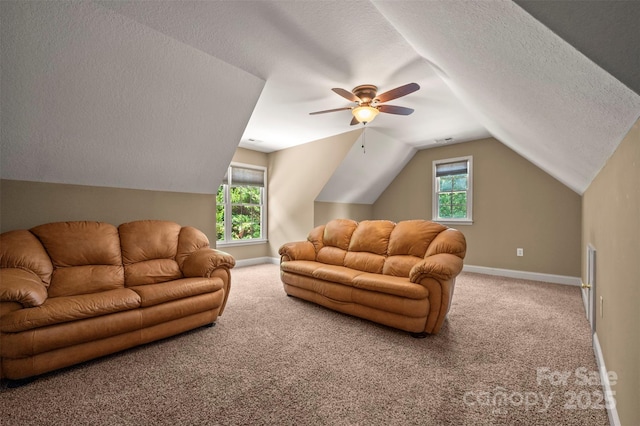 60 Bridge Ln, Tryon, NC 28782 - carpeted living area with a textured ceiling, vaulted ceiling, ceiling fan, and plenty of natural light